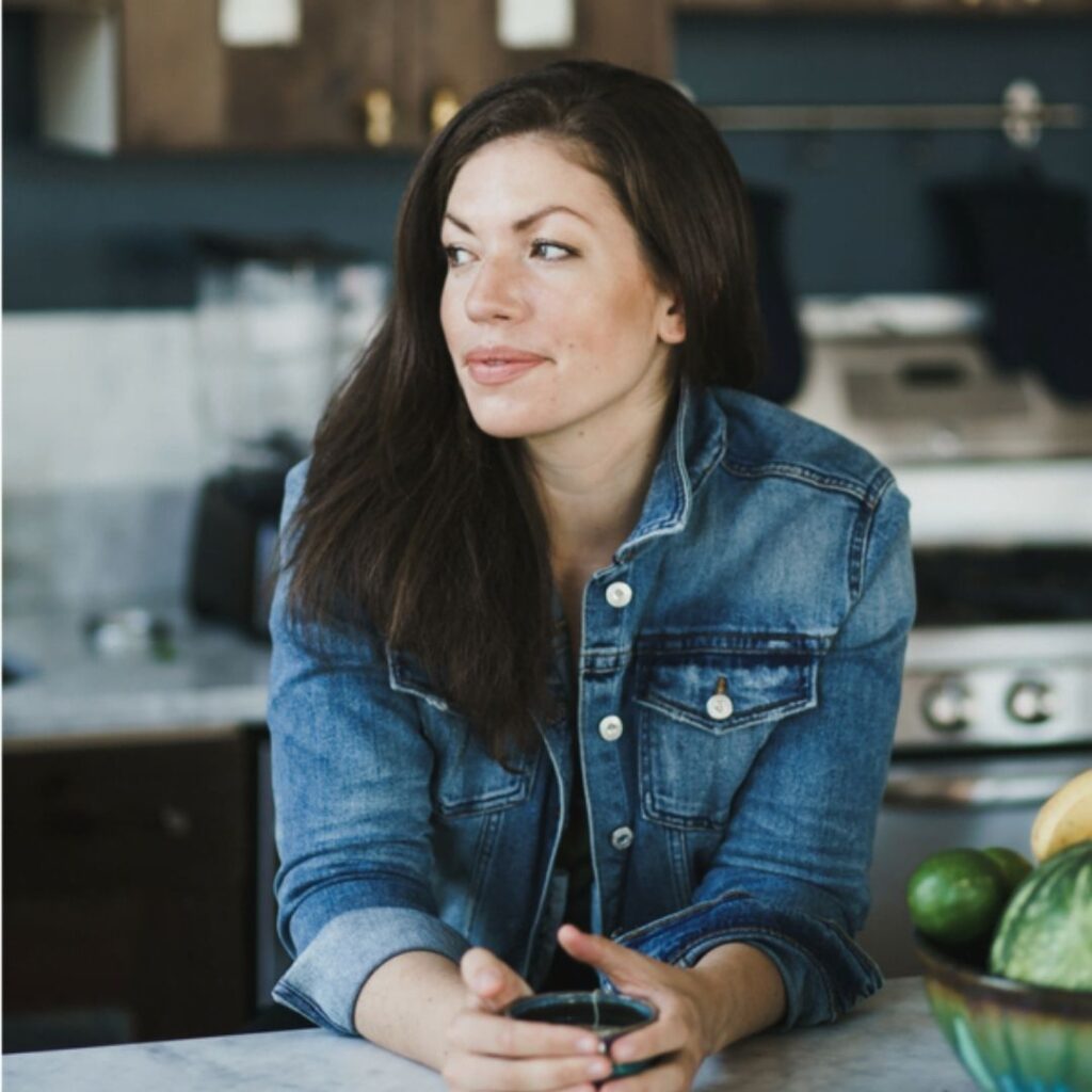 Kim-Julie Hansen in a jean jacket in a kitchen